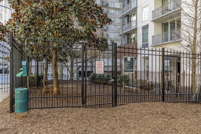 view of gate with fence