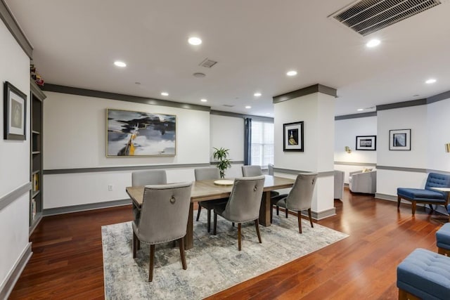 dining room with recessed lighting, wood finished floors, visible vents, and baseboards