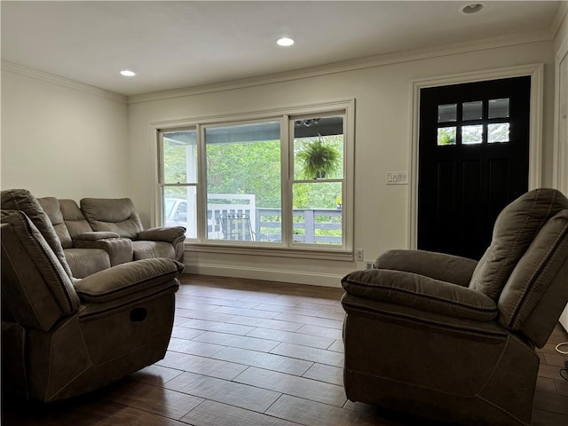 living room with dark hardwood / wood-style floors and ornamental molding