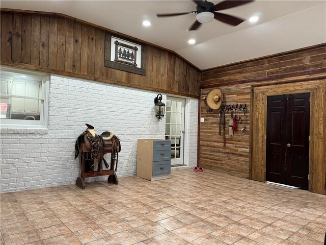 tiled living room with wood walls and brick wall