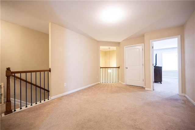 unfurnished room featuring carpet flooring