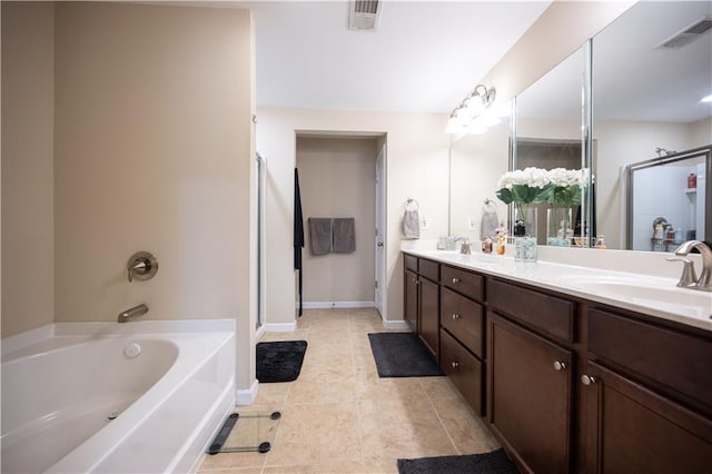 bathroom with tile patterned flooring, shower with separate bathtub, and vanity