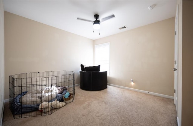 interior space with ceiling fan and carpet floors