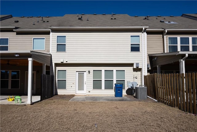 rear view of property featuring a patio area and central AC unit