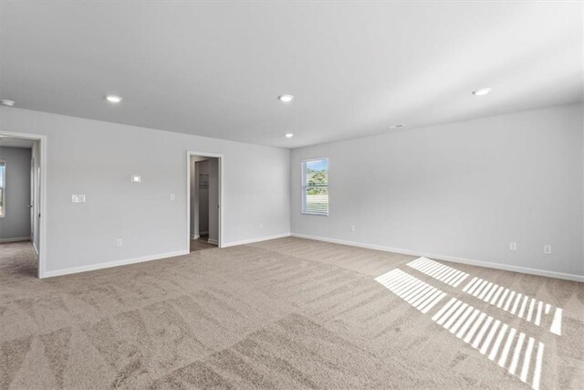 full bathroom with wood finished floors, a sink, visible vents, baseboards, and double vanity