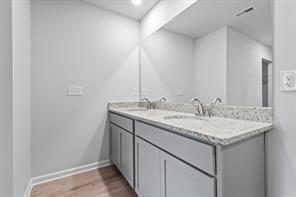 stairway featuring carpet floors and baseboards