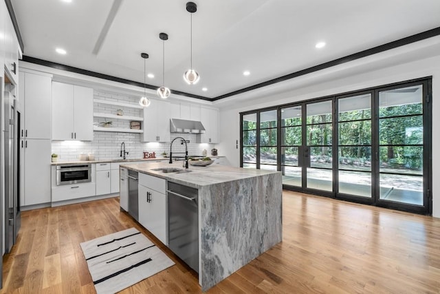 4366 Skyland Dr NE, Atlanta, GA 30342 - kitchen with decorative backsplash, a sink, range hood, and stainless steel appliances