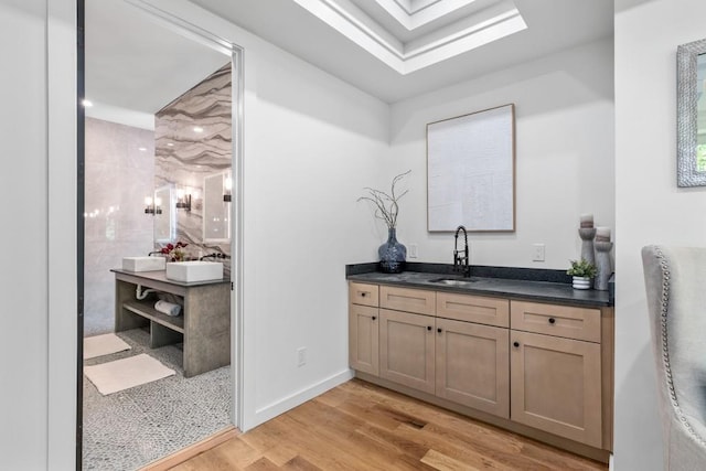 4366 Skyland Dr NE, Atlanta, GA 30342 - bar featuring recessed lighting, baseboards, a sink, and light wood-style floors