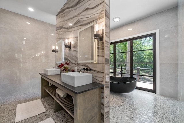 4366 Skyland Dr NE, Atlanta, GA 30342 - bathroom with tile walls, a soaking tub, a sink, and double vanity