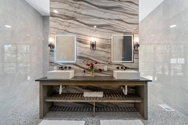 4366 Skyland Dr NE, Atlanta, GA 30342 - full bathroom with a sink, visible vents, and tile walls