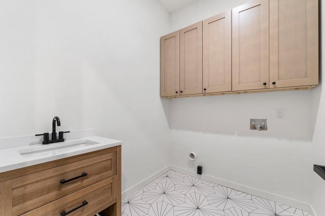 4366 Skyland Dr NE, Atlanta, GA 30342 - clothes washing area featuring baseboards, a sink, cabinet space, and hookup for a washing machine