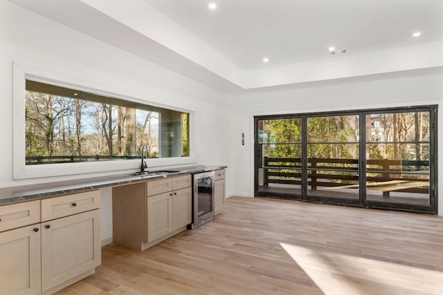 4366 Skyland Dr NE, Atlanta, GA 30342 - kitchen with light wood-type flooring, a sink, beverage cooler, and a healthy amount of sunlight