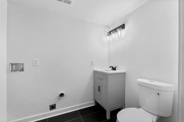 4366 Skyland Dr NE, Atlanta, GA 30342 - half bathroom featuring vanity, baseboards, toilet, tile patterned flooring, and visible vents