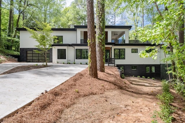 4366 Skyland Dr NE, Atlanta, GA 30342 - back of house featuring driveway and stucco siding