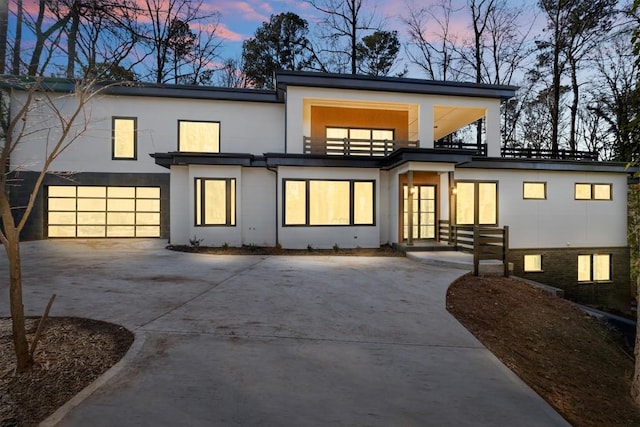 4366 Skyland Dr NE, Atlanta, GA 30342 - back of house at dusk with stucco siding and concrete driveway