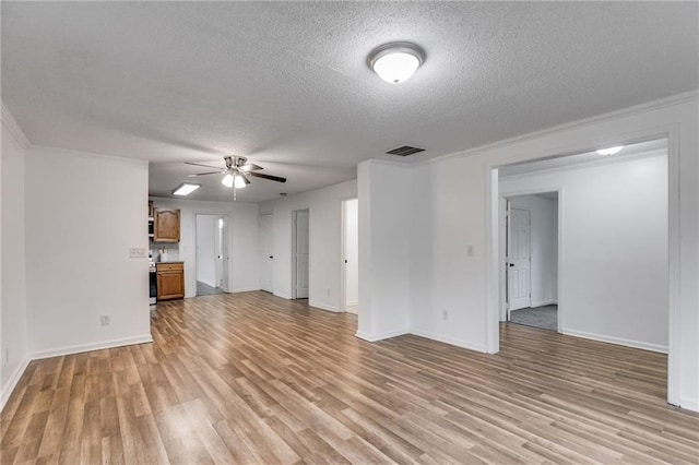 unfurnished living room with crown molding, a textured ceiling, light hardwood / wood-style flooring, and ceiling fan