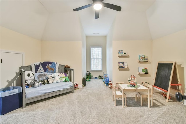 bedroom with lofted ceiling, ceiling fan, and carpet