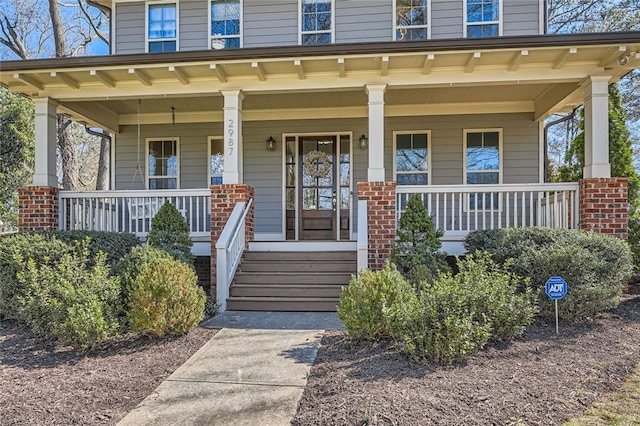 doorway to property with covered porch