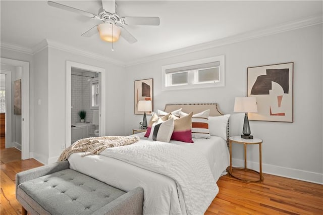 bedroom with ceiling fan, ensuite bathroom, crown molding, and hardwood / wood-style flooring