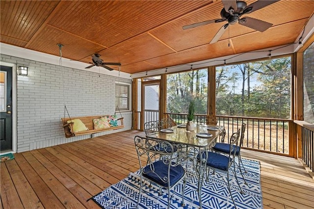 sunroom with wooden ceiling and ceiling fan