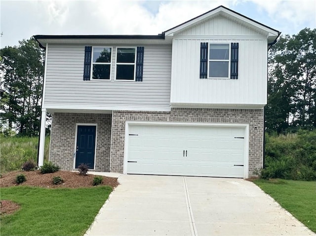 119 Deer Xing, Temple, GA 30179 - view of front of property featuring brick siding, concrete driveway, a garage, and a front yard
