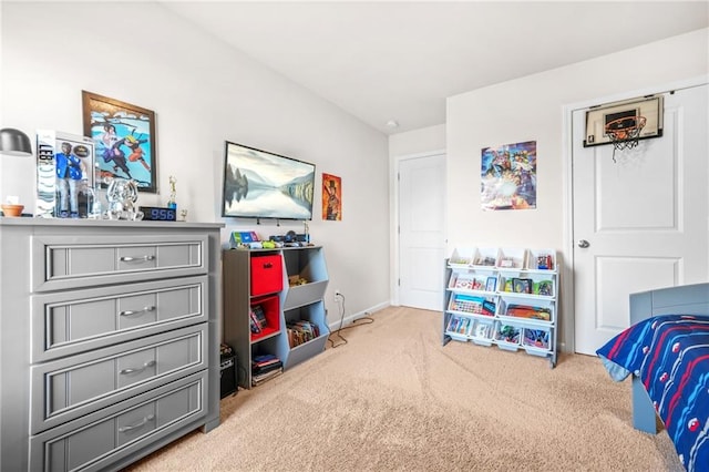 bedroom with carpet flooring and baseboards