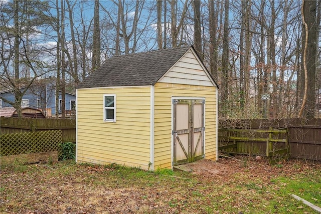 view of shed with fence