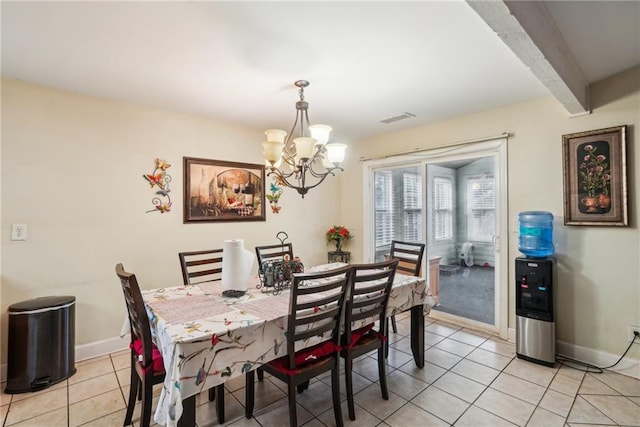 dining area featuring light tile patterned floors, baseboards, visible vents, and beam ceiling