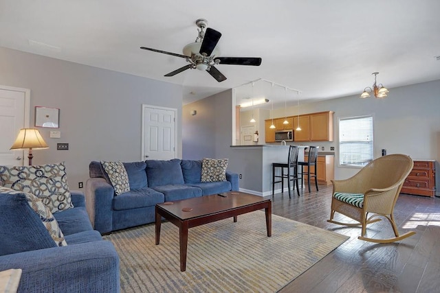 living area with baseboards, wood-type flooring, ceiling fan, and rail lighting