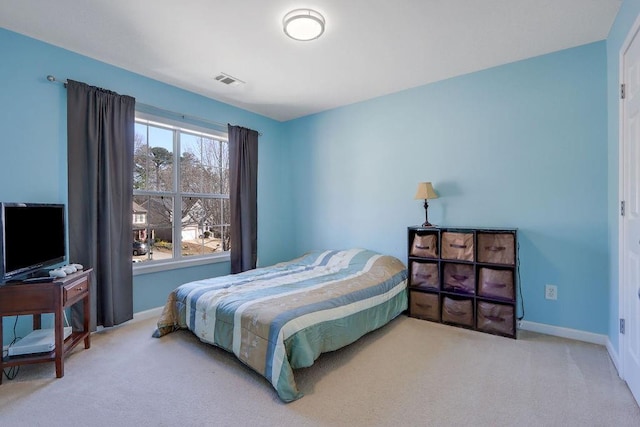 bedroom featuring carpet, visible vents, and baseboards