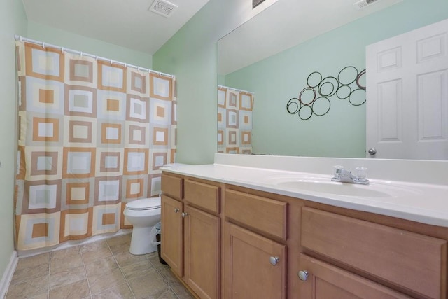 bathroom featuring visible vents, toilet, vanity, and a shower with curtain