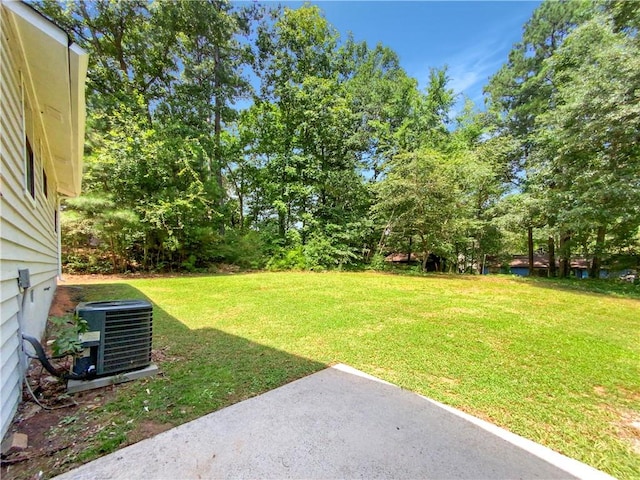 view of yard with central AC