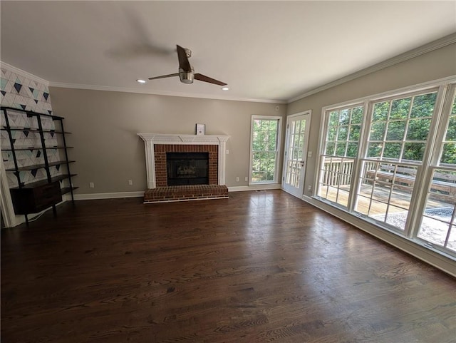5882 Grandview Ct NW, Acworth, GA 30101 - unfurnished living room with a ceiling fan, ornamental molding, a brick fireplace, dark wood-type flooring, and recessed lighting