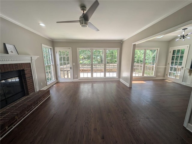 5882 Grandview Ct NW, Acworth, GA 30101 - unfurnished living room featuring a ceiling fan, dark wood-style floors, a brick fireplace, ornamental molding, and recessed lighting