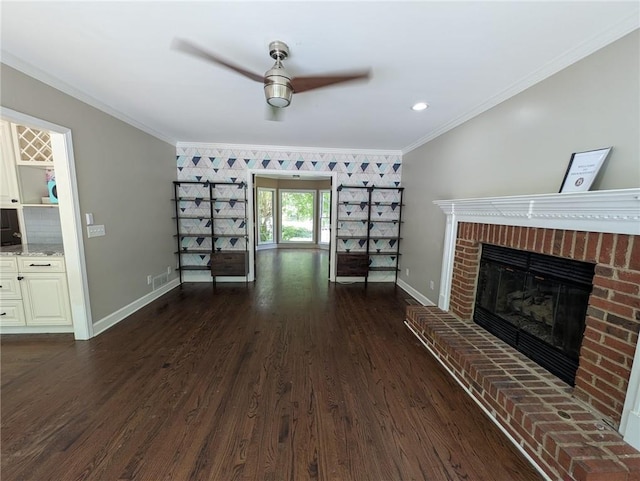 5882 Grandview Ct NW, Acworth, GA 30101 - unfurnished living room featuring crown molding, a ceiling fan, a brick fireplace, and dark wood-style flooring