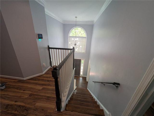 5882 Grandview Ct NW, Acworth, GA 30101 - stairs featuring wood finished floors, a chandelier, and ornamental molding