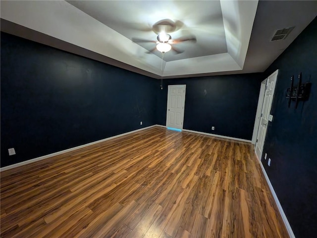 5882 Grandview Ct NW, Acworth, GA 30101 - spare room with a ceiling fan, a raised ceiling, and wood finished floors