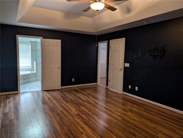 5882 Grandview Ct NW, Acworth, GA 30101 - unfurnished room featuring a raised ceiling, dark wood-style floors, and ceiling fan