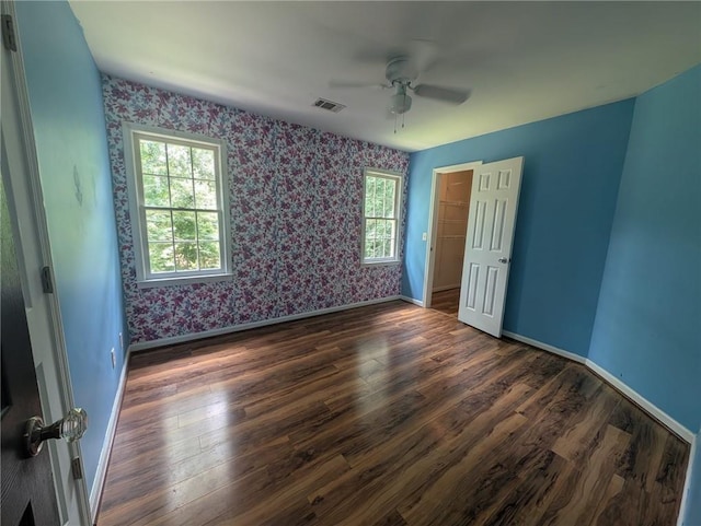5882 Grandview Ct NW, Acworth, GA 30101 - unfurnished bedroom featuring wallpapered walls, dark wood-style floors, and ceiling fan