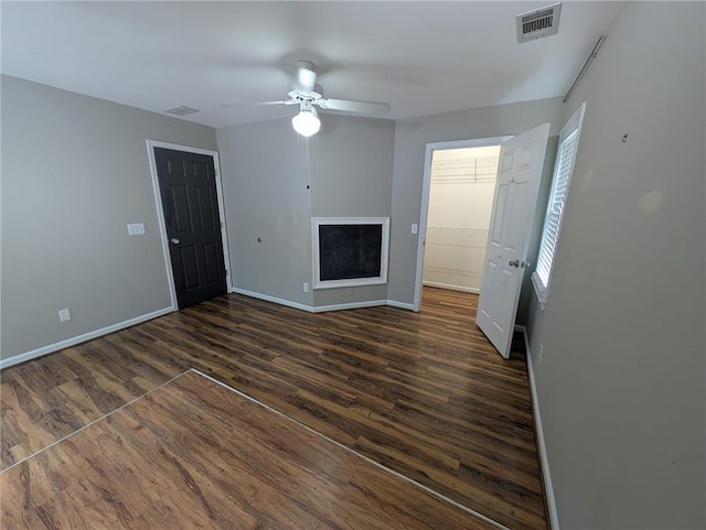 5882 Grandview Ct NW, Acworth, GA 30101 - unfurnished living room featuring dark wood-type flooring and a ceiling fan