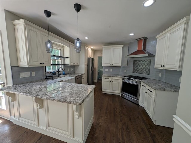 5882 Grandview Ct NW, Acworth, GA 30101 - kitchen featuring appliances with stainless steel finishes, wall chimney exhaust hood, a peninsula, backsplash, and dark wood-type flooring
