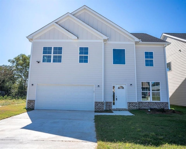 view of front facade with a garage and a front lawn