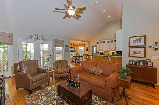 living room featuring ceiling fan, french doors, hardwood / wood-style flooring, and high vaulted ceiling