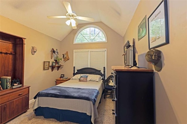 bedroom with light carpet, vaulted ceiling, and ceiling fan