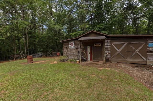 view of outdoor structure with a lawn