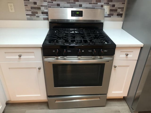 details with stainless steel appliances and tasteful backsplash