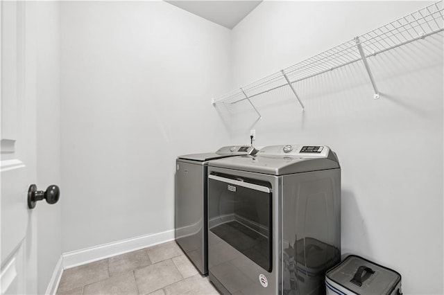 348 Meeler Cir, Bogart, GA 30622 - laundry area with separate washer and dryer and light tile patterned floors
