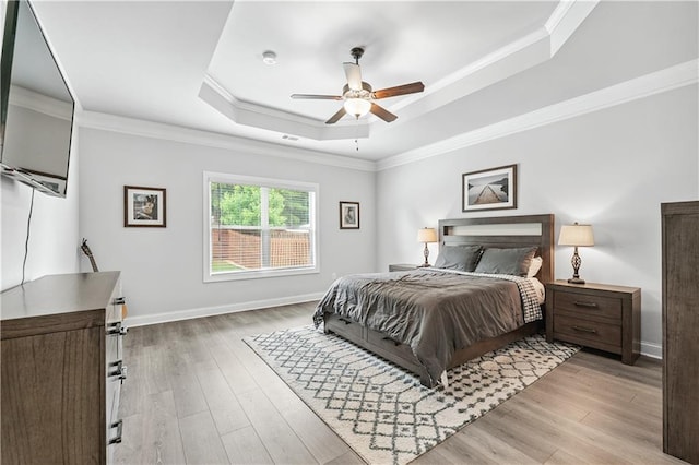 348 Meeler Cir, Bogart, GA 30622 - bedroom with a tray ceiling, light wood-style floors, ornamental molding, and ceiling fan