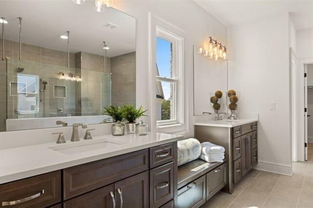 5247 Flannery Chase SW, Powder Springs, GA 30127 - bathroom featuring tile patterned flooring, a shower stall, vanity, and baseboards