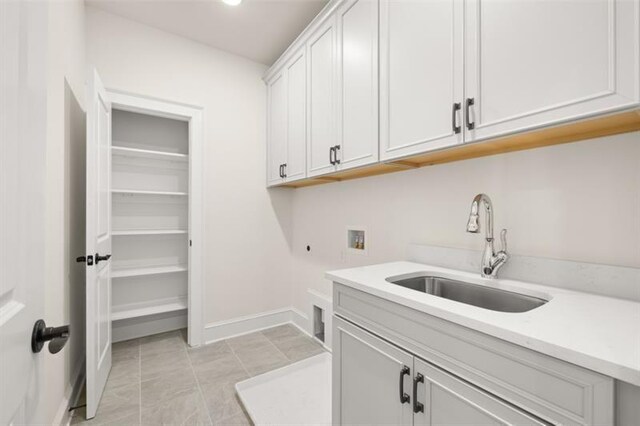 5247 Flannery Chase SW, Powder Springs, GA 30127 - laundry area with washer hookup, cabinet space, electric dryer hookup, and baseboards